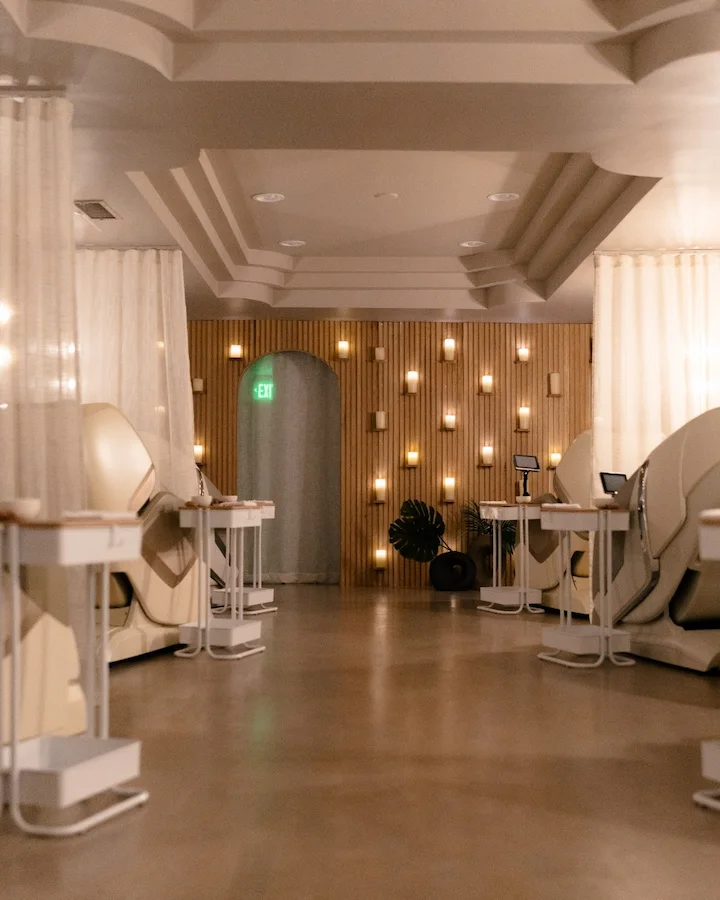Modern lounge area with cozy pod seating and warm lighting.